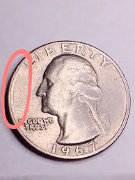 1967 Washington quarter wrong planchet error struck on dime-sized planchet showing size mismatch and partial design